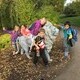 Children standing with statue of lion.